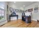 Well-lit home office with a desk, hardwood floors, and decorative molding throughout at 4204 Magnolia Ct, North Charleston, SC 29420