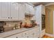Modern kitchen featuring stainless steel appliances, granite countertops, tile backsplash, and white cabinets at 4204 Magnolia Ct, North Charleston, SC 29420