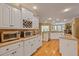 Well-appointed kitchen showcasing white cabinets, granite countertops, wine rack, and modern appliances at 4204 Magnolia Ct, North Charleston, SC 29420