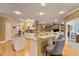 Open concept kitchen featuring island with bar seating, granite countertops, and hardwood floors at 4204 Magnolia Ct, North Charleston, SC 29420