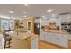 Beautiful kitchen with white cabinets, granite countertops, stainless steel appliances, and an island with bar seating at 4204 Magnolia Ct, North Charleston, SC 29420