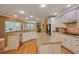 Spacious kitchen with island, stainless appliances, granite countertops, and hardwood floors at 4204 Magnolia Ct, North Charleston, SC 29420