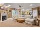 Bright living room boasts a fireplace, plush sectional sofa, and elegant decor at 4204 Magnolia Ct, North Charleston, SC 29420