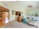 Open living room with neutral tones, large windows, and comfortable seating arrangements at 4204 Magnolia Ct, North Charleston, SC 29420