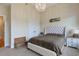 Bright main bedroom featuring a chandelier, a bed, and a sitting bench at 4204 Magnolia Ct, North Charleston, SC 29420