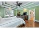 Large main bedroom featuring a comfortable bed, wooden dresser, and hardwood floors at 4204 Magnolia Ct, North Charleston, SC 29420