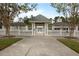 Entrance to the pool area, featuring white picket fences and white gazebo structures, offering a serene atmosphere at 4204 Magnolia Ct, North Charleston, SC 29420