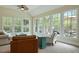 Bright sunroom with large windows and access to a deck, perfect for relaxing at 4204 Magnolia Ct, North Charleston, SC 29420
