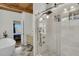 Modern bathroom featuring a glass enclosed shower and a free standing bathtub with a wood paneled ceiling at 4701 Apple St, North Charleston, SC 29405