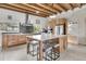 Modern kitchen with custom cabinets, stainless steel appliances, an island with seating and white countertop at 4701 Apple St, North Charleston, SC 29405