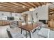 Bright kitchen and dining area with an island, stainless steel appliances, and an adjacent dining table at 4701 Apple St, North Charleston, SC 29405