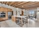 Open-concept kitchen boasts stainless appliances, central island with seating, and a dining area at 4701 Apple St, North Charleston, SC 29405