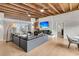 Open-concept living room with a sleek fireplace, hardwood floors, and tons of natural light at 4701 Apple St, North Charleston, SC 29405