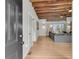 View of the living room from the doorway. Featuring a wood ceiling and refinished wood floors at 4701 Apple St, North Charleston, SC 29405