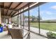 Relaxing screened porch with comfortable seating and panoramic views of the outdoor scenery at 4701 Apple St, North Charleston, SC 29405