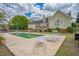 Private backyard oasis with in-ground pool, lounge chairs, and lush landscaping at 527 W Butternut Rd, Summerville, SC 29483