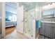Bathroom with glass-enclosed shower, grey vanity with marble counter and access to bedroom at 527 W Butternut Rd, Summerville, SC 29483