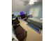 Bright bedroom with sloped ceilings, a cozy bed, and a window with blinds at 527 W Butternut Rd, Summerville, SC 29483