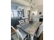 Inviting dining area with a rustic table, white chairs, and view into the adjacent living room at 527 W Butternut Rd, Summerville, SC 29483