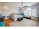 Spacious main bedroom with ceiling fan, plantation shutters, and hardwood floors at 527 W Butternut Rd, Summerville, SC 29483
