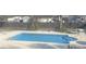 Sparkling pool with a spacious patio area, perfect for relaxation and outdoor enjoyment in a private backyard setting at 527 W Butternut Rd, Summerville, SC 29483