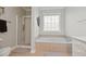 Bright bathroom with a separate shower and soaking tub, plus a window for natural light at 5276 7Th Green Dr, Hollywood, SC 29449