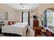 Bedroom with a ceiling fan and an exterior window bringing in natural light to brighten the space at 5276 7Th Green Dr, Hollywood, SC 29449