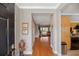 Inviting foyer with bamboo flooring, a view to the living room, and detailed trim work at 5276 7Th Green Dr, Hollywood, SC 29449