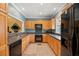 Efficient kitchen with light wood cabinets, sleek appliances, and ample counter space at 5276 7Th Green Dr, Hollywood, SC 29449