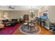 Inviting living room with ceiling fan, dining area, and pass-through to the kitchen at 5276 7Th Green Dr, Hollywood, SC 29449