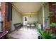 Charming patio with seating, lush greenery, a brick accent wall, and access to the outdoors at 5276 7Th Green Dr, Hollywood, SC 29449