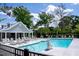 Beautiful community swimming pool with ample seating, a lift, and a nearby covered area at 5276 7Th Green Dr, Hollywood, SC 29449