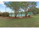 Community tennis courts surrounded by lush greenery and mature trees with Spanish moss at 5276 7Th Green Dr, Hollywood, SC 29449