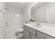 Bright bathroom featuring a gray vanity, combination shower and bathtub at 547 Pontoon Rd, Huger, SC 29450