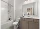 This bright bathroom features a shower-tub combo and a stylish vanity with a sink and modern fixtures at 547 Pontoon Rd, Huger, SC 29450