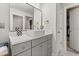 A bathroom featuring a vanity with a modern vessel sink, gray cabinets, gold fixtures, and an open closet at 547 Pontoon Rd, Huger, SC 29450