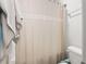 Clean bathroom with a toilet and neutral shower curtain at 547 Pontoon Rd, Huger, SC 29450
