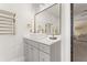 A bathroom featuring a vanity with a modern vessel sink, gray cabinets, and gold fixtures at 547 Pontoon Rd, Huger, SC 29450