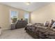 This bedroom features neutral walls, carpet floors, and windows that allow natural light to fill the room at 547 Pontoon Rd, Huger, SC 29450