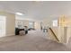 The large bonus room features carpet floors and plenty of space for entertaining or relaxing at 547 Pontoon Rd, Huger, SC 29450