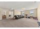 This carpeted bonus room provides ample space, natural light, and easy access to adjacent rooms at 547 Pontoon Rd, Huger, SC 29450