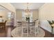Bright dining room featuring a chandelier and a round table with seating for six at 547 Pontoon Rd, Huger, SC 29450