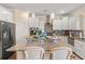 Modern kitchen with granite island and white cabinetry offering style and function at 547 Pontoon Rd, Huger, SC 29450
