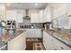 Well-appointed kitchen with granite counters, stainless appliances, and ample storage space at 547 Pontoon Rd, Huger, SC 29450