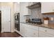 Charming kitchen with stainless steel appliances, granite countertops, and white cabinets at 547 Pontoon Rd, Huger, SC 29450