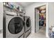 A laundry room featuring modern washer and dryer units and access to a walk-in closet at 547 Pontoon Rd, Huger, SC 29450