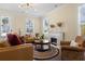 Bright living room featuring a fireplace, hardwood floors, and natural lighting at 547 Pontoon Rd, Huger, SC 29450