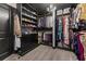 A walk-in closet featuring custom shelving, hanging racks, and a stylish chandelier at 547 Pontoon Rd, Huger, SC 29450