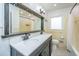 Bathroom with a double sink, decorative mirror, and shower and bathtub combo at 6018 Ridgecrest Ave, Hanahan, SC 29410