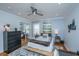This is a primary bedroom with an area rug, ceiling fan, and closet with mirrored doors at 6018 Ridgecrest Ave, Hanahan, SC 29410